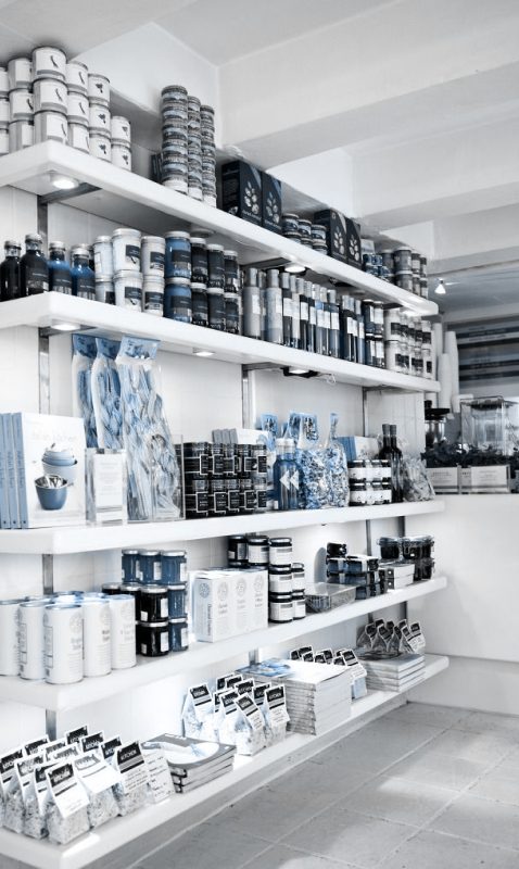 Shelves full of products including kitchen appliances located in a retail chain.